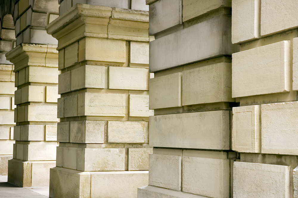 Archway view of colonnade by state capitol building